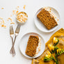 Delicious Carrot-Coconut Cake recipe idea topped with crunchy, plain Raw Coconut Flakes by Coconut Merchant.