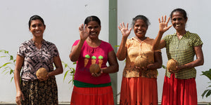 coconut farmers smiling and waving